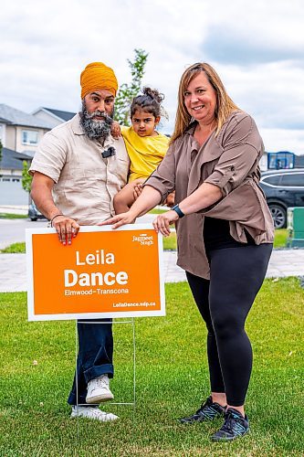 NIC ADAM / FREE PRESS
NDP Leader Jagmeet Singh, his youngest daughter, and NDP candidate Leila Dance (from left), set up campaign signs in Peguis Friday for the upcoming Elmwood-Transcona byelection.
240809 - Friday, August 09, 2024.

Reporter: Aaron