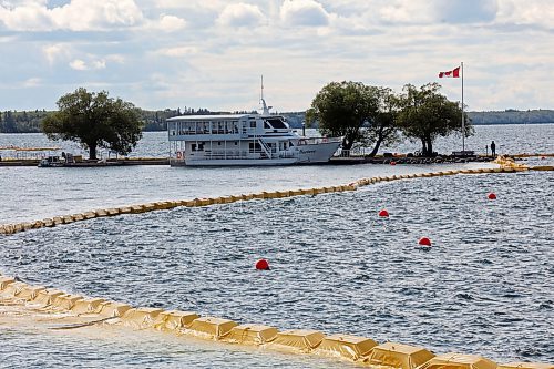 09082024
The containment curtain set up to prevent the spread of zebra mussels in Clear Lake in Riding Mountain National Park is seen Friday along with the Martese cruise boat at the marina, which is currently docked for the season as part of ongoing zebra mussel mitigation. 
(Tim Smith/The Brandon Sun)