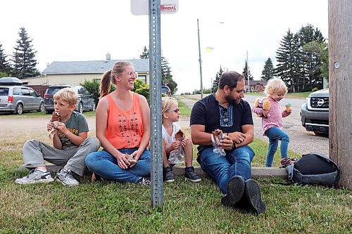 08082024
Sophia and Jay Korban and their children Benjamin, Gabriella and Kassia enjoy ice-cream during Sandy Lake Western Days at Sandy Lake, Manitoba on Friday. Western Days runs until Sunday with a variety of town events and entertainment. 
(Tim Smith/The Brandon Sun)