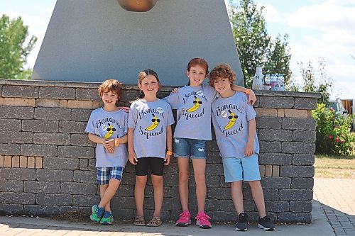 Left: Laddley Golinski, Lexa Thompson with her sister, Brielle, and Theodore Golinski pose for a picture during the Banana Days festival on Saturday afternoon at the Banana Belt statue site. Photos: Abiola Odutola/The Brandon Sun