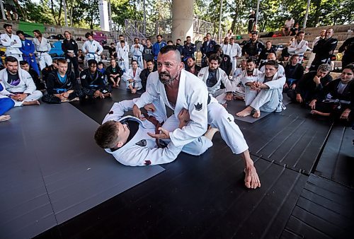 JOHN WOODS / FREE PRESS
Matt MacDonald of Balance Jiu Jitsu, gives a demonstration with his son Logan during the Strangle In The Park at the Forks Sunday, August 11, 2024. Strangle In The Park is an outdoor community open mat and seminar event. About 130 jiu jitsu members from 22 academies from southern Manitoba came together for a day of grappling and training. The event raised $110 for a dream child at  Dream Factory.

Reporter: ?