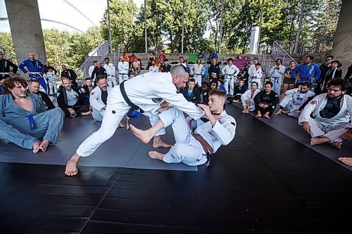 JOHN WOODS / FREE PRESS
Matt MacDonald of Balance Jiu Jitsu, gives a demonstration with his son Logan during the Strangle In The Park at the Forks Sunday, August 11, 2024. Strangle In The Park is an outdoor community open mat and seminar event. About 130 jiu jitsu members from 22 academies from southern Manitoba came together for a day of grappling and training. The event raised $110 for a dream child at  Dream Factory.

Reporter: ?