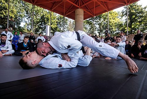 JOHN WOODS / FREE PRESS
Matt MacDonald of Balance Jiu Jitsu, gives a demonstration with his son Logan during the Strangle In The Park at the Forks Sunday, August 11, 2024. Strangle In The Park is an outdoor community open mat and seminar event. About 130 jiu jitsu members from 22 academies from southern Manitoba came together for a day of grappling and training. The event raised $110 for a dream child at  Dream Factory.

Reporter: ?