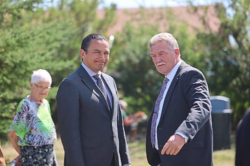 Left: Premier Wab Kinew speaks with Carberry Mayor Raymond Muirhead shortly before the memorial ceremony held Sunday at the Day Lily Garden in honour of the first responders, 17 people who died, and eight others who were injured in the incident. Photos: Abiola Odutola/The Brandon Sun