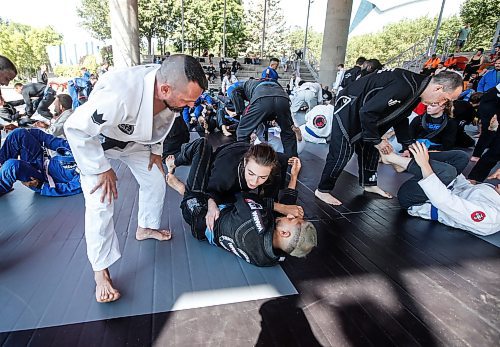 JOHN WOODS / FREE PRESS
Matt MacDonald of Balance Jiu Jitsu, instructs some grapplers during the Strangle In The Park at the Forks Sunday, August 11, 2024. Strangle In The Park is an outdoor community open mat and seminar event. About 130 jiu jitsu members from 22 academies from southern Manitoba came together for a day of grappling and training. The event raised $110 for a dream child at  Dream Factory.

Reporter: ?