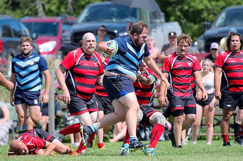 Barbs forward Josh Koop breaks a Dauphin Mavericks tackle during their Rugby Manitoba men's Division 2 game at John Reilly Field on Saturday. (Thomas Friesen/The Brandon Sun)