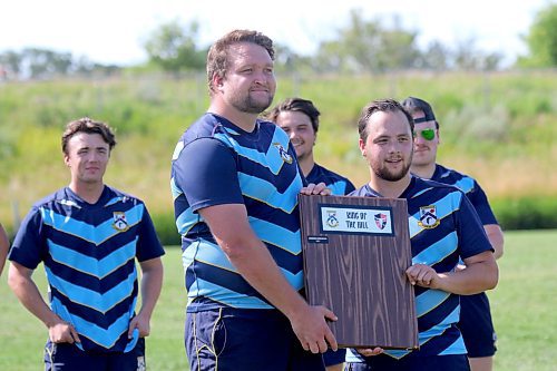 Barbs captains Tyler Colquhoun, left, and Kade Turnbull pose with the King of the Hill shield. (Thomas Friesen/The Brandon Sun)