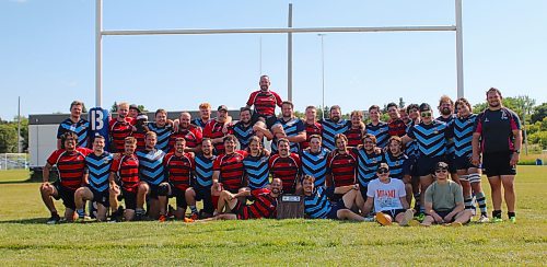 The Brandon Barbarians and Dauphin Mavericks pose for a group photo after their King of the Hill match at John Reilly Field on Saturday. (Thomas Friesen/The Brandon Sun)