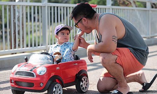 Ruth Bonneville / Free Press

Standup - Enjoying ice cream on a hot day in August in a little mini convertible Cooper (push) car.

Two-year-old Marcelo Gomez enjoys a cone in a dish of cool ice cream from Bridge Drive Inn with his parents and family on Monday. 

At one point he shared some with his dad, Robert,  but quickly went back to eating it himself while hanging out in his mini convertible Cooper push car. 


Aug 9th, 2024
