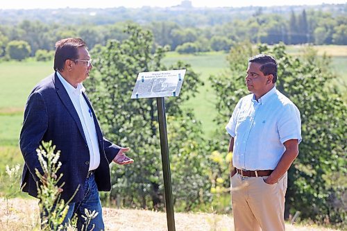 Sioux Valley Dakota Nation Chief Vince Tacan talks with Crown-Indigenous Relations Minister Gary Anandasangaree at the site of the former Brandon Indian Residential School on Monday. (Tim Smith/The Brandon Sun)