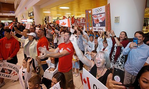 JOHN WOODS / FREE PRESS
Fans cheer as Skylar Park, Olympic bronze medalist in taekwondo, arrives at the Winnipeg airport as she returns from Paris Monday, August 12, 2024. 

Reporter: ken