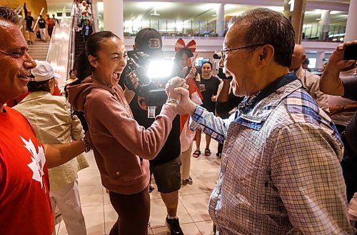 JOHN WOODS / FREE PRESS
Skylar Park, Olympic bronze medalist in taekwondo, hi-fives her grandfather Grandmaster Duek Hwa Park as she arrives at the Winnipeg airport as she returns from Paris Monday, August 12, 2024. 

Reporter: ken