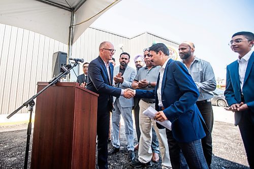 MIKAELA MACKENZIE / FREE PRESS

	
Mayor Scott Gillingham shakes hands with Duffy&#x573; Taxi general manager Ram Valluru at the ribbon-cutting for Duffy&#x573; Taxi&#x573; new building on Notre Dame on Monday, Aug. 12, 2024.

For Aaron Epp story.