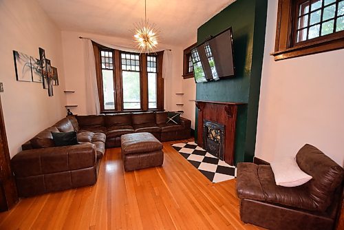 Todd Lewys / Winnipeg Free Press



With its original hardwoods, ornamental fireplace and oak-trimmed windows, the living warm is a cozy, relaxing space.

