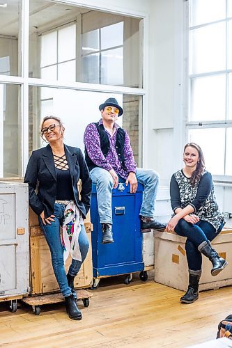 MIKAELA MACKENZIE / WINNIPEG FREE PRESS

Dawn Marie Chartrand (left), Gator Beaulieu, and Rose-Anne Harder pose for a photo with crates full of visual arts exhibitions in the Manitoba Arts Network offices building in Winnipeg on Tuesday, Oct. 25, 2022. The Manitoba Arts Network is hosting a Manitoba Showcase at their annual conference this weekend. For AV story.
Winnipeg Free Press 2022.