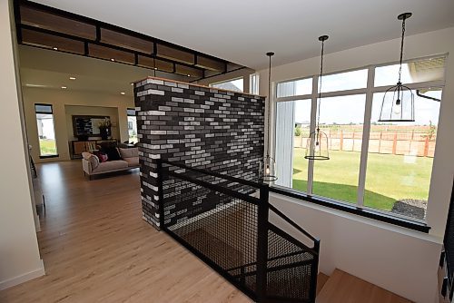 Todd Lewys / Winnipeg Free Press



A custom metal staircase with huge window behind it ushers you inside with a wonderful sense of space and inflow of natural light.