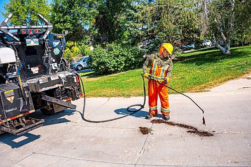 NIC ADAM / FREE PRESS
Workers from City Works repair Julien Pl. in St. Norbert after residents resorted to patching a section on their own after spending two years contacting the city. The section of street reportedly had rebar showing and was causing issues with vehicles and children’s bicycles.
240813 - Tuesday, August 13, 2024.

Reporter: Tyler