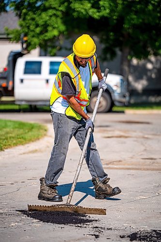 NIC ADAM / FREE PRESS
Workers from City Works repair Julien Pl. in St. Norbert after residents resorted to patching a section on their own after spending two years contacting the city. The section of street reportedly had rebar showing and was causing issues with vehicles and children&#x2019;s bicycles.
240813 - Tuesday, August 13, 2024.

Reporter: Tyler