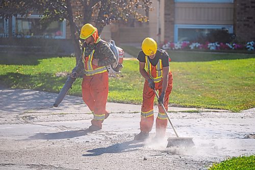 NIC ADAM / FREE PRESS
Workers from City Works repair Julien Pl. in St. Norbert after residents resorted to patching a section on their own after spending two years contacting the city. The section of street reportedly had rebar showing and was causing issues with vehicles and children&#x2019;s bicycles.
240813 - Tuesday, August 13, 2024.

Reporter: Tyler