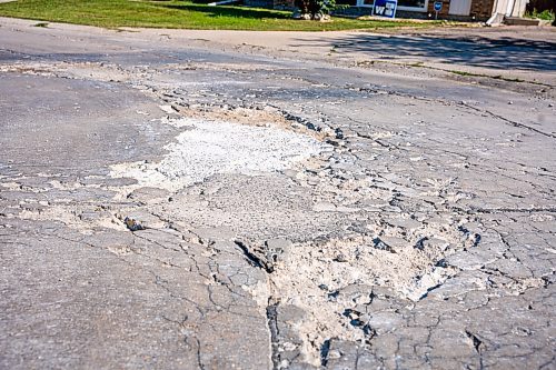 NIC ADAM / FREE PRESS
Workers from City Works repair Julien Pl. in St. Norbert after residents resorted to patching a section on their own after spending two years contacting the city. The section of street reportedly had rebar showing and was causing issues with vehicles and children&#x2019;s bicycles.
240813 - Tuesday, August 13, 2024.

Reporter: Tyler