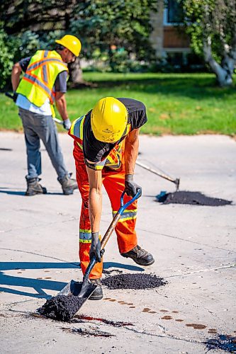 NIC ADAM / FREE PRESS
Workers from City Works repair Julien Pl. in St. Norbert after residents resorted to patching a section on their own after spending two years contacting the city. The section of street reportedly had rebar showing and was causing issues with vehicles and children&#x2019;s bicycles.
240813 - Tuesday, August 13, 2024.

Reporter: Tyler