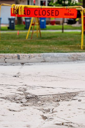 NIC ADAM / FREE PRESS
Potholes plague Greensboro Square in Waverley Heights pictured Tuesday afternoon. 
240813 - Tuesday, August 13, 2024.

Reporter: ?