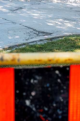 NIC ADAM / FREE PRESS
Potholes plague Greensboro Square in Waverley Heights pictured Tuesday afternoon. 
240813 - Tuesday, August 13, 2024.

Reporter: ?