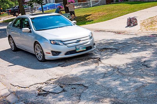 NIC ADAM / FREE PRESS
Potholes plague Augusta dr. in Waverley Heights pictured Tuesday afternoon. 
240813 - Tuesday, August 13, 2024.

Reporter: ?