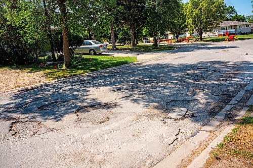 NIC ADAM / FREE PRESS
Potholes plague Augusta dr. in Waverley Heights pictured Tuesday afternoon. 
240813 - Tuesday, August 13, 2024.

Reporter: ?