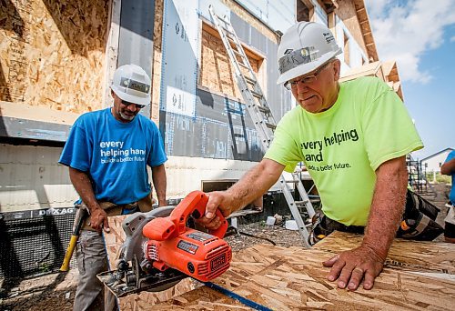 JOHN WOODS / FREE PRESS
Jerry Storie, right, volunteer leader at Habitat For Humanity, is photographed with Michel Roy on a building site on Pandora Ave W Tuesday, August 13, 2024. Storie is a retired educator and former MLA.

Reporter: ken