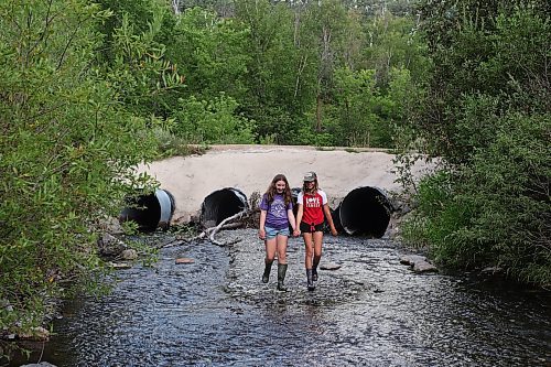 13082023
Best friends Georgia Richards and Myah LeBoutillier explore the shale creek at Big Valley northwest of Neepawa after a picnic with Richards brother and grandmother on Tuesday afternoon.
(Tim Smith/The Brandon Sun)