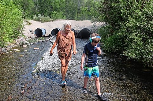 13082023
Colleen McKillop and her grandson Dawson Richards wade along the shale creek at Big Valley northwest of Neepawa after a picnic with Richards sister and her friend on Tuesday afternoon.
(Tim Smith/The Brandon Sun)