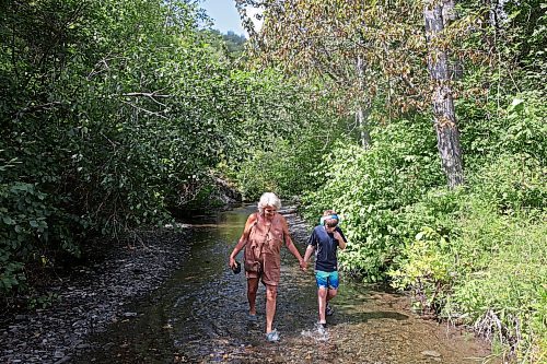 13082023
Colleen McKillop and her grandson Dawson Richards wade along the shale creek at Big Valley northwest of Neepawa after a picnic with Richards sister and her friend on Tuesday afternoon.
(Tim Smith/The Brandon Sun)