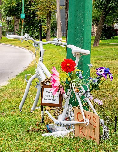 NIC ADAM / FREE PRESS
The ghost bike memorial to honour the life of Rob Jenner, the cyclist who died last month to a hit and run driver on Wellington Cres near Cockburn St, sits without its wheels, which were stolen last night, Wednesday.
240814 - Wednesday, August 14, 2024.

Reporter: ?