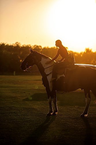 MIKAELA MACKENZIE / FREE PRESS

	
Alyssa Selman pats her horse, Duke, before she competes at the Denim & Dust Barrel Racing Series in Carman on Tuesday, Aug. 13, 2024.

For Mike McIntyre story.