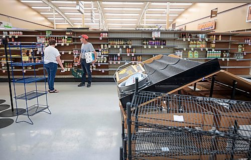 Ruth Bonneville / Free Press

Standup - Family Foods closes 

After 20 years in business the owner of Dakota Family Foods closes its doors Tuesday.  Customers seem to linger as they hunt for last minute deals even though many shelves lay empty with some shelving units with sticker prices on them to be sold as well.

Longtime employee Jeff Parker, moves  shelving and cleans up water from ice and pop machines after they get taken away.   He says he feels sad that such a great place to work is really closing 

 Aug 13th, 2024
