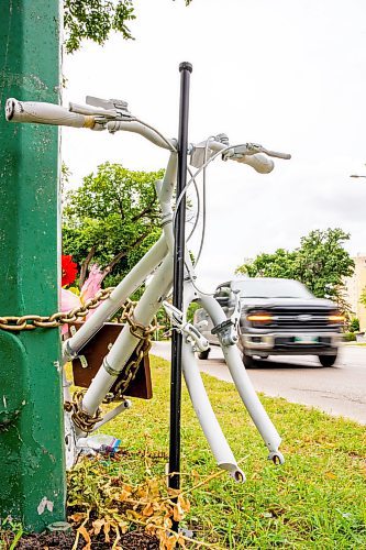 NIC ADAM / FREE PRESS
The ghost bike memorial to honour the life of Rob Jenner, the cyclist who died last month to a hit and run driver on Wellington Cres near Cockburn St, sits without its wheels, which were stolen last night, Wednesday.
240814 - Wednesday, August 14, 2024.

Reporter: ?