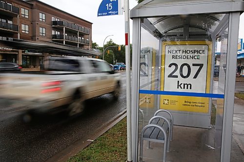 A truck drives past a Victoria Avenue bus stop just outside Superstore sporting a poster from the Canadian Cancer Society as part of a campaing to advocate for the creation of a hospice in Brandon. (Matt Goerzen/The Brandon Sun)