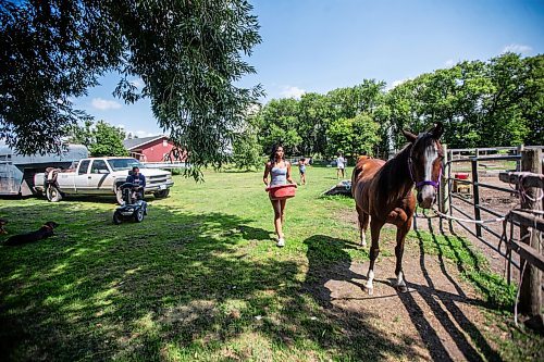 MIKAELA MACKENZIE / FREE PRESS

	
Kimisha Scott (15) feeds horses on Alyssa Selman&#x573; property near Graysville on Tuesday, Aug. 13, 2024.

For Mike McIntyre story.