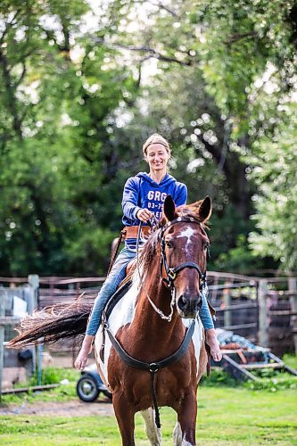 MIKAELA MACKENZIE / FREE PRESS

	
Alyssa Selman with her horse, Duke, on her property near Graysville on Tuesday, Aug. 13, 2024.

For Mike McIntyre story.