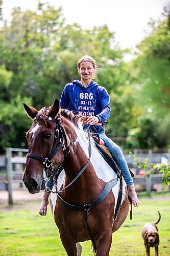 MIKAELA MACKENZIE / FREE PRESS

	
Alyssa Selman with her horse, Duke, on her property near Graysville on Tuesday, Aug. 13, 2024.

For Mike McIntyre story.