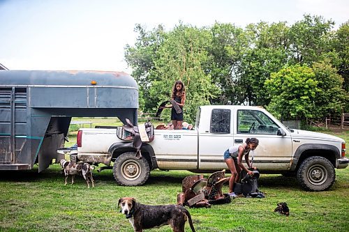 MIKAELA MACKENZIE / FREE PRESS

	
Ari Selman (left, 23) and Raelene Husbands (12) load the tack into the truck for the races on Tuesday, Aug. 13, 2024.

For Mike McIntyre story.