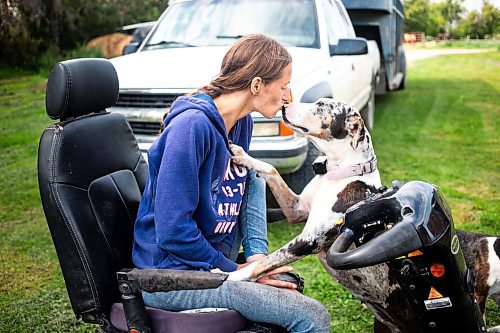 MIKAELA MACKENZIE / FREE PRESS

	
Alyssa Selman kisses her dog on her property near Graysville on Tuesday, Aug. 13, 2024.

For Mike McIntyre story.