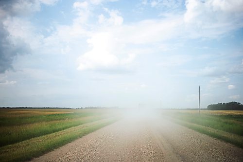 MIKAELA MACKENZIE / FREE PRESS

	
Two trucks towing horse trailers kick up a cloud of dust on the way to the Denim &amp; Dust Barrel Racing Series in Carman on Tuesday, Aug. 13, 2024.

For Mike McIntyre story.