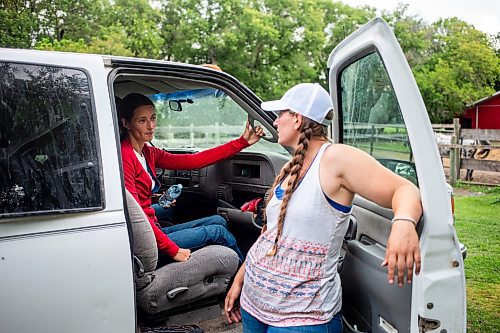 MIKAELA MACKENZIE / FREE PRESS

	
Alyssa Selman (left) and her sister, Amy Scott, get into the truck to drive to the races in Carman on Tuesday, Aug. 13, 2024.

For Mike McIntyre story.