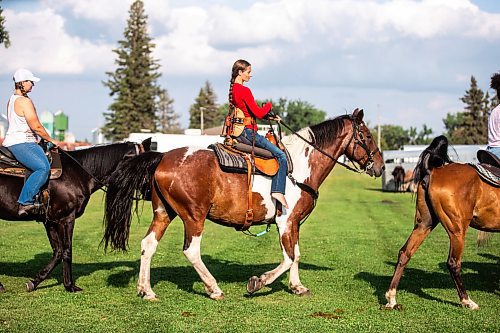 MIKAELA MACKENZIE / FREE PRESS

	
Alyssa Selman rides out to warm up her horse, Duke, at the Denim &amp; Dust Barrel Racing Series in Carman on Tuesday, Aug. 13, 2024.

For Mike McIntyre story.