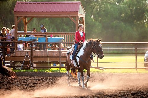 MIKAELA MACKENZIE / FREE PRESS

	
Alyssa Selman warms up her horse, Duke, at the Denim &amp; Dust Barrel Racing Series in Carman on Tuesday, Aug. 13, 2024.

For Mike McIntyre story.