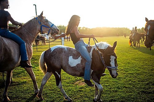 MIKAELA MACKENZIE / FREE PRESS

	
Ari Selman rides pony Arcadia bareback while hanging around at the Denim &amp; Dust Barrel Racing Series in Carman on Tuesday, Aug. 13, 2024.

For Mike McIntyre story.