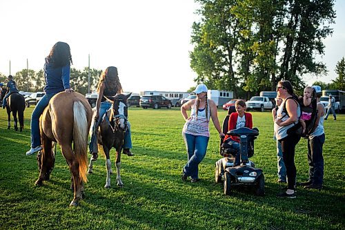 MIKAELA MACKENZIE / FREE PRESS

	
Alyssa Selman hangs out at the Denim &amp; Dust Barrel Racing Series in Carman on Tuesday, Aug. 13, 2024.

For Mike McIntyre story.