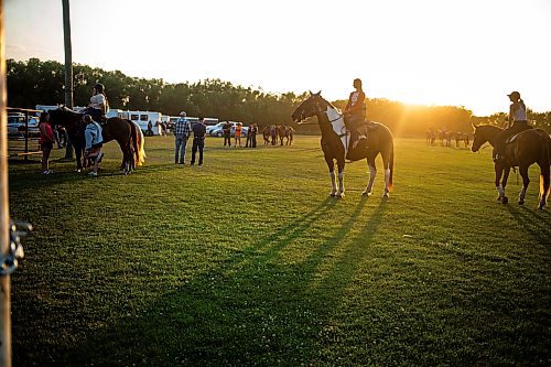 MIKAELA MACKENZIE / FREE PRESS

	
Alyssa Selman (centre) watches the open races before she competes at the Denim &amp; Dust Barrel Racing Series in Carman on Tuesday, Aug. 13, 2024.

For Mike McIntyre story.